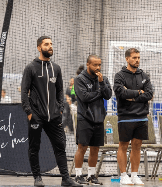 NXT Level Futsal coaches together at the indoor facility